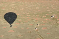 Shadow cast by balloon on fairy circles.  Note the tracking vehicles. 