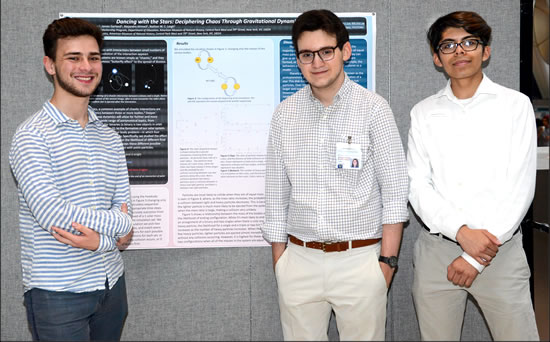 Harper Clees-Baron, James Garland, and Alejandro Ahmed with their research poster 