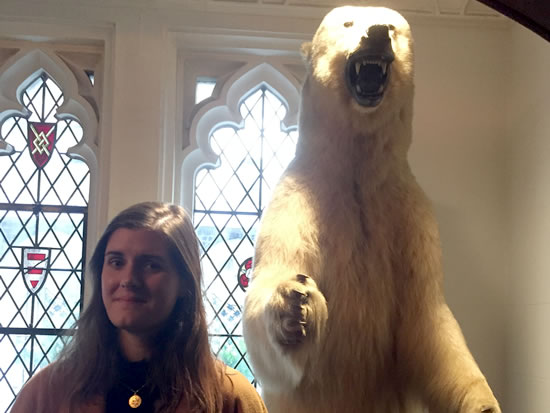Margaux Montagner get acquainted with the polar bear who resides at the Explorer's Club 