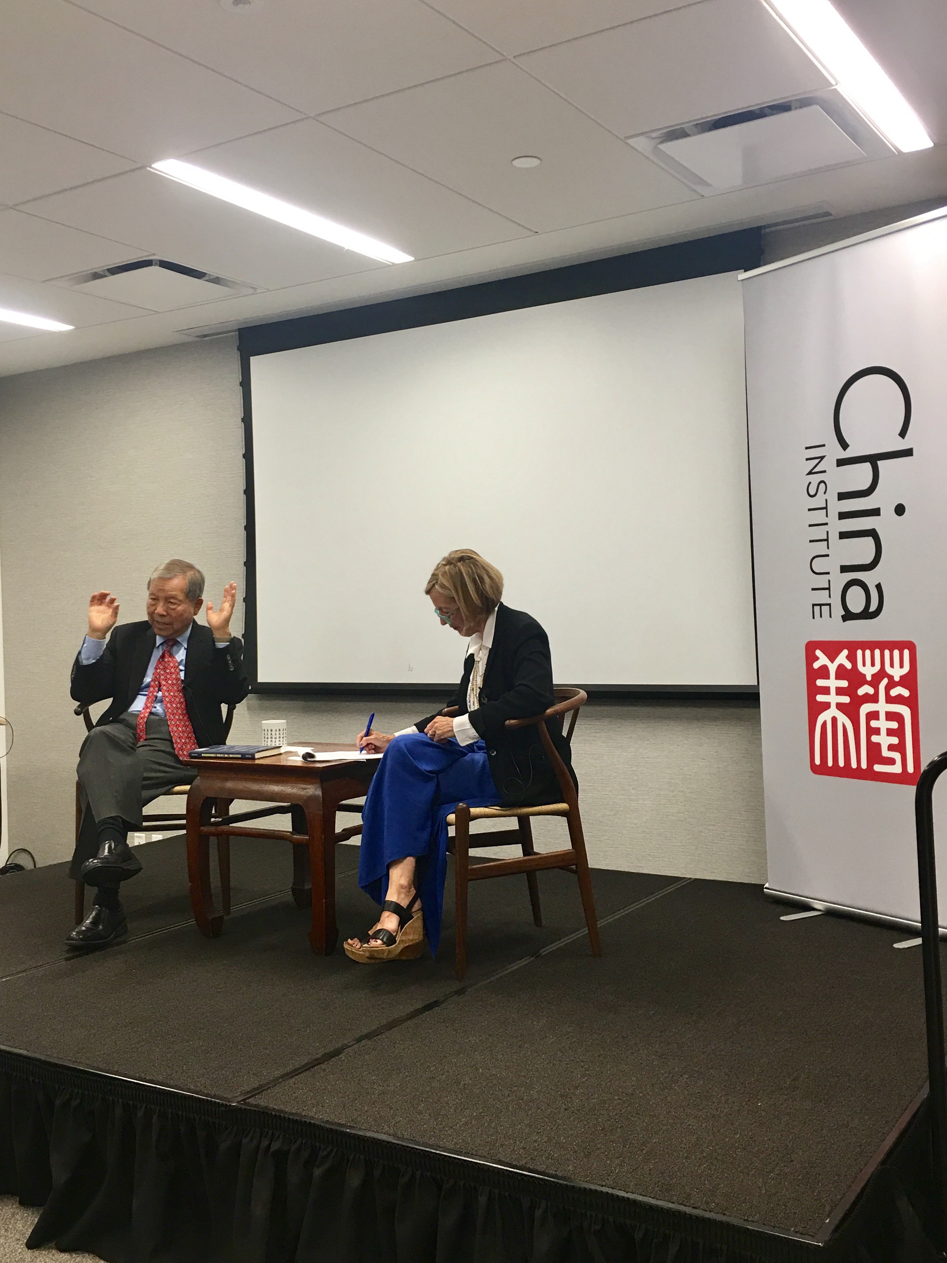 Caption: Yukon Huang (left) and Dorinda Elliott (right) at China Institute, Sep. 7, 2017